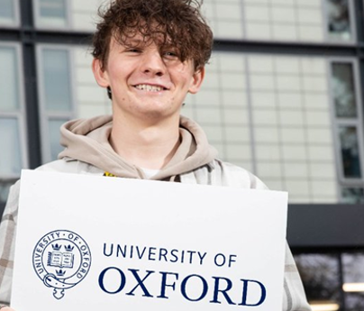 head shot of Morgan Grimshaw holding University of Oxford sign