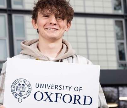 Morgan Grimshaw holding University of Oxford sign