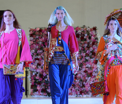 models on catwalk runway wearing bright colourful clothing