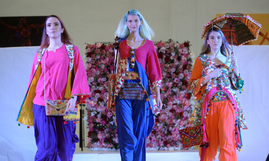 models on catwalk runway wearing bright colourful clothing
