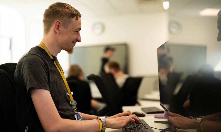 Young man looking at a computer screen 