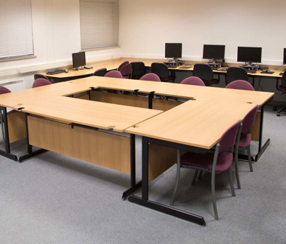 Training room with tables, chairs and computers