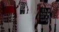 student fashion exhibit featuring clothing with long sleeve tops and 'it's a bad day not a bad life' printed on