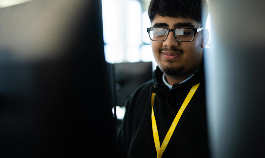 Student looking at computer monitors
