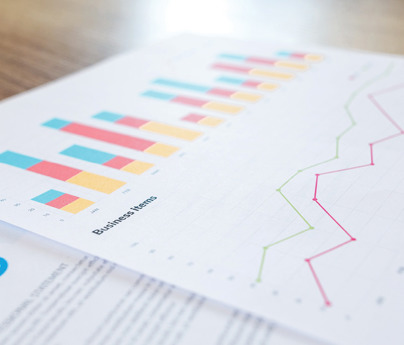 close up of business spreadsheets and charts