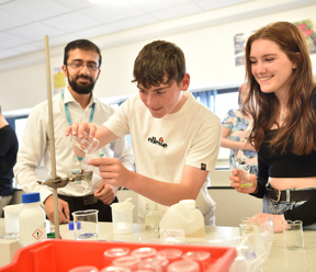 Open Event Visitors conducting Science experiment