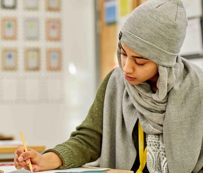 art student drawing on desk