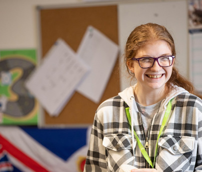 student smiling in classroom