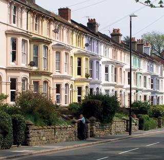 street of houses with gardens in uk