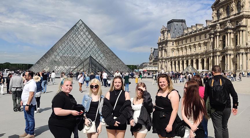 Students in front of Louvre Pyramid