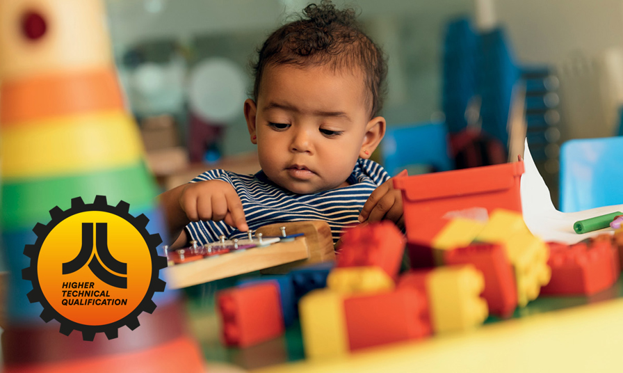 close up of baby playing with wooden toys