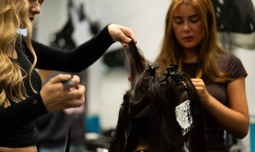 Students styling hair 