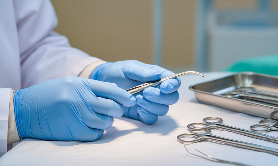 hands holding dental tools