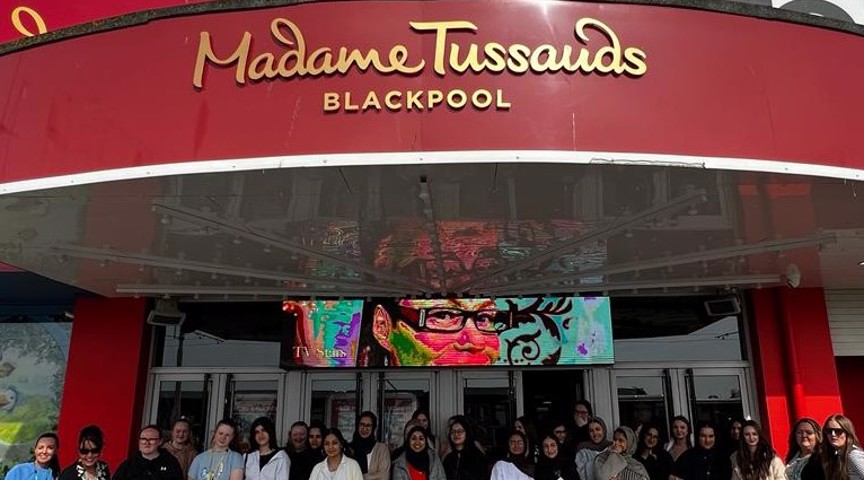 Posing outside entrance of Madame Tussauds